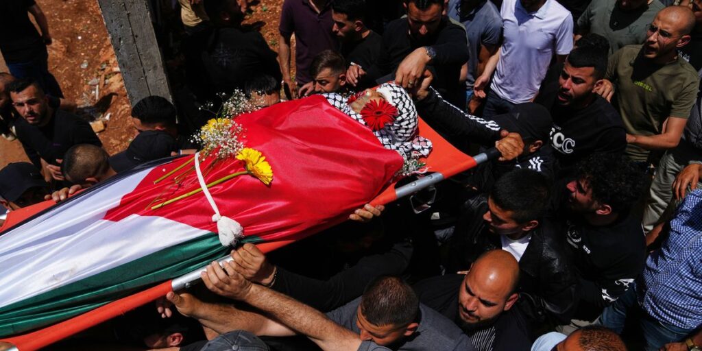 Palestinian man shot dead while climbing West Bank barrier into Israel in search of work Palestinian man shot dead while climbing West Bank barrier into Israel in search of work