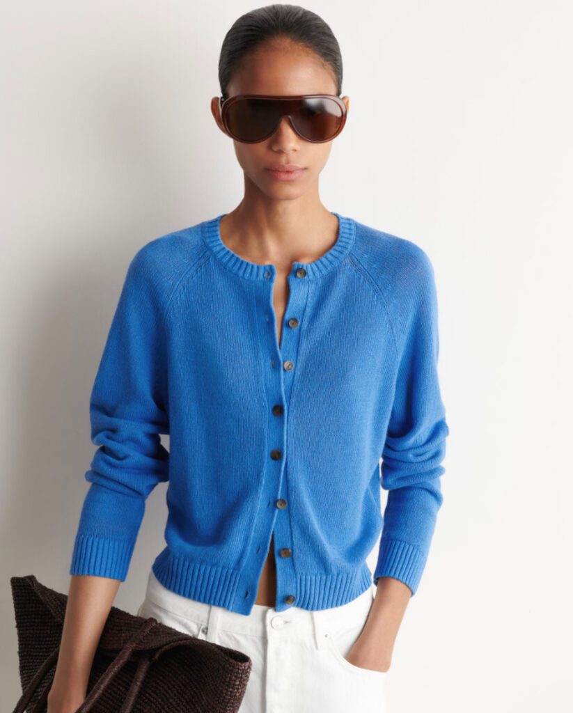 Cobalt blue button-down knit cardigan with raglan sleeves and aviator sunglasses – lightweight layering piece for cool Croatia summer evenings