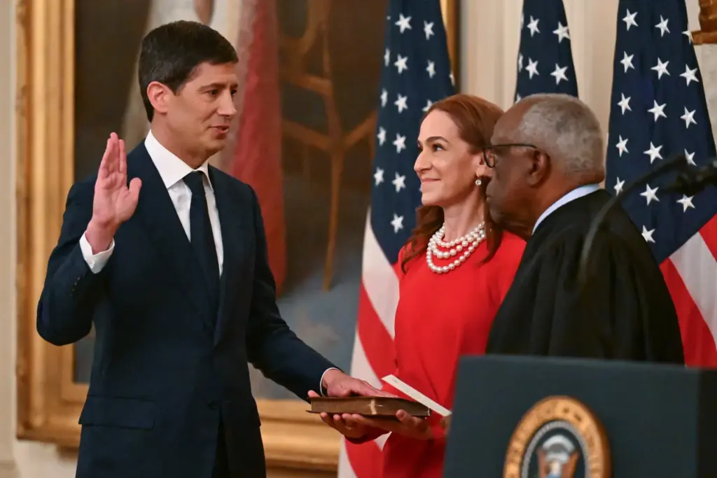 Kevin Warsh (L) takes the oath of office from U.S. Supreme Court Associate Justice Clarence Thomas (R) to be the new Chairman of the Federal Reserve at the White House on May 22, 2026 in Washington, DC. (Photo by Roberto Schmidt/Getty Images)