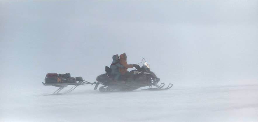George Clooney snowmobiling across Vatnajokull glacier in Iceland George Clooney snowmobiling across Vatnajokull glacier in Iceland