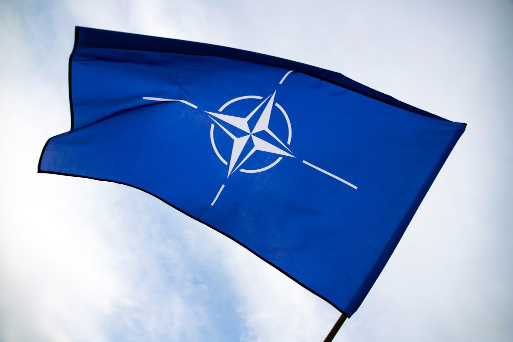 NATO flag.North Atlantic Treaty Organization flag waving.