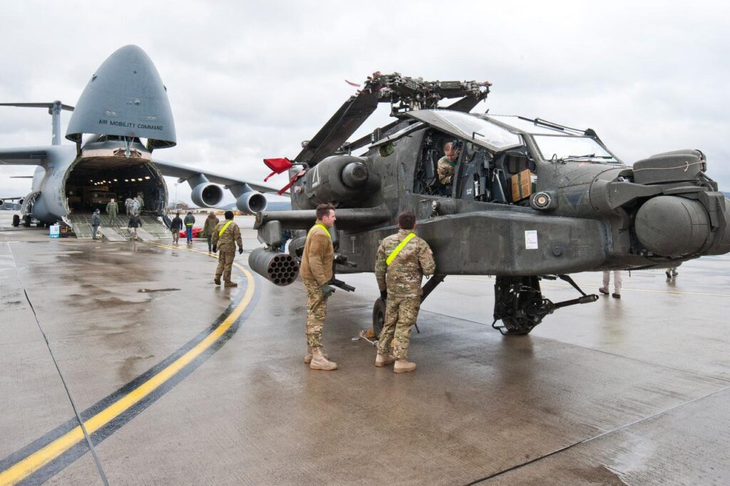 NATO, top Republicans question US troop withdrawal from Germany An AH-64 Apache attack helicopter stands in front of a Galaxy C-5 transport plane at the US Air Base in Ramstein, western Germany, February 22, 2017. (AFP File Photo)