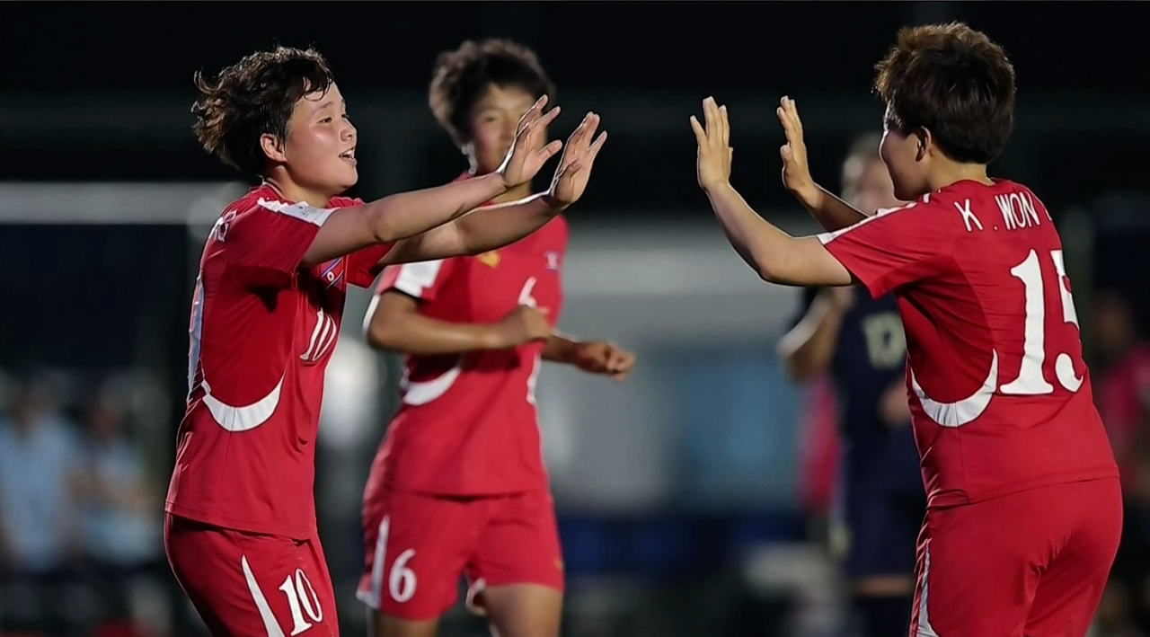 North Korean women’s football players celebrate after defeating Thailand 6-0 in the quarterfinals of the 2026 Asian Football Confederation Under-17 Women’s Asian Cup on May 11 to advance to the semifinals, in this image aired by Korean Central Television on May 12. (KCTV-Yonhap)