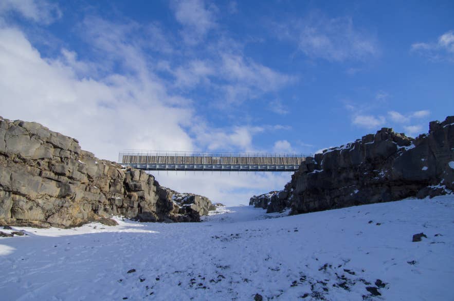 Steel footbridge across the rift at the Bridge Between Continents on the Reykjanes Peninsula in winter Steel footbridge across the rift at the Bridge Between Continents on the Reykjanes Peninsula in winter