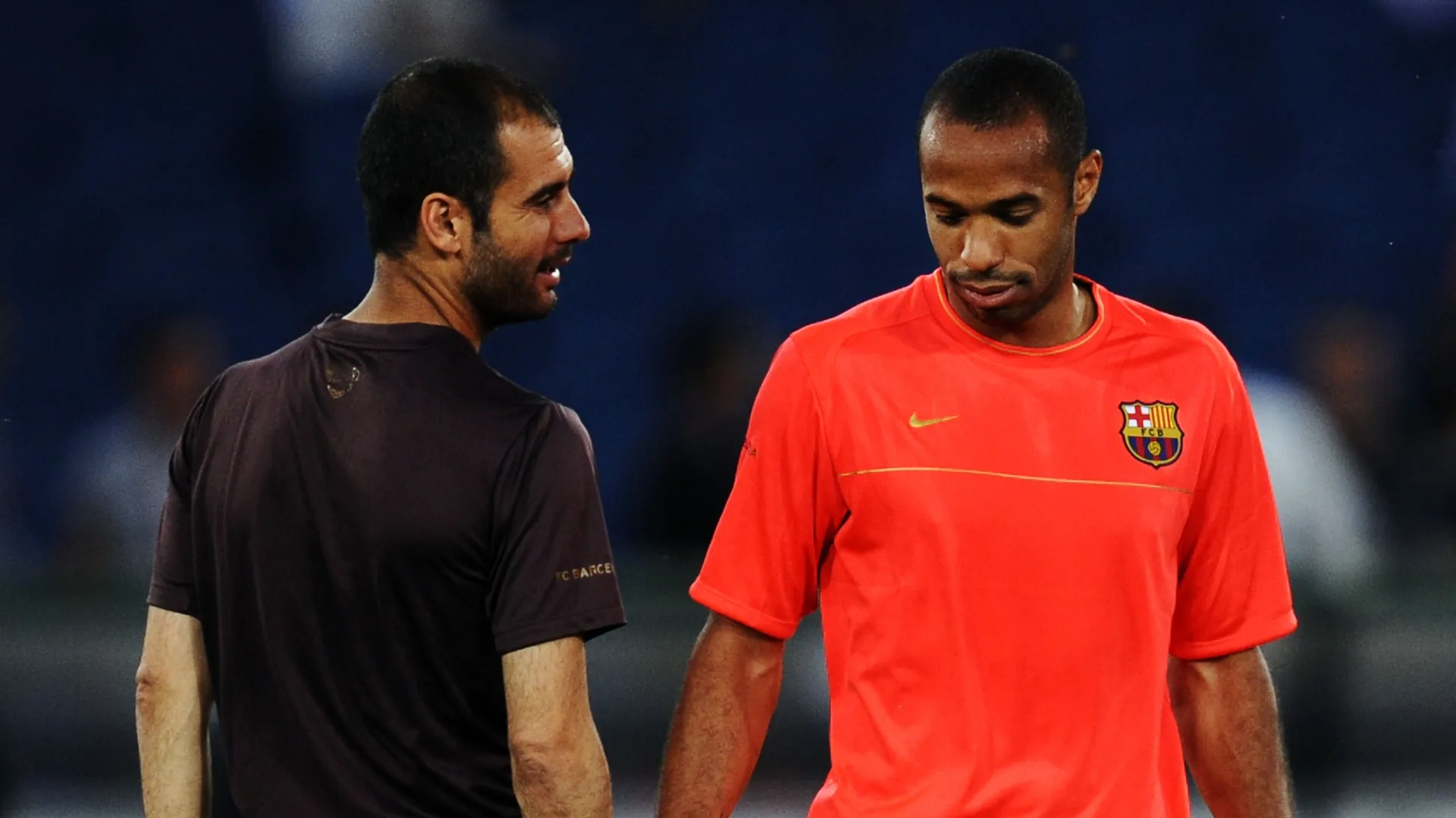 Josep Guardiola coach of Barcelona talks to Thierry Henry.