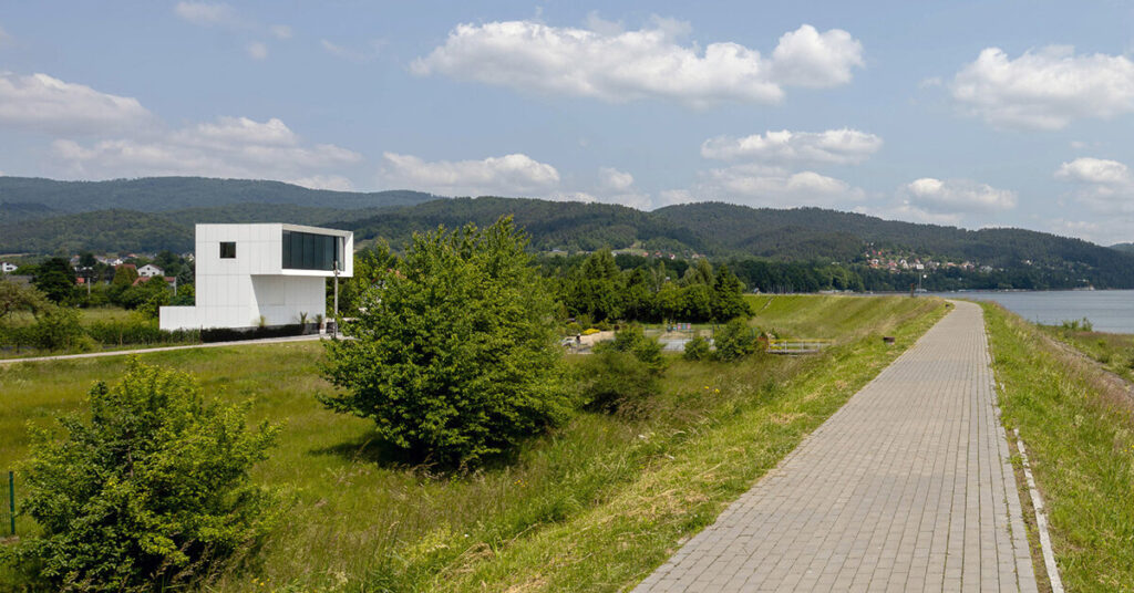 white aluminum cladding wraps tetris-like lake residence in poland white aluminum cladding wraps tetris-like lake residence in poland
