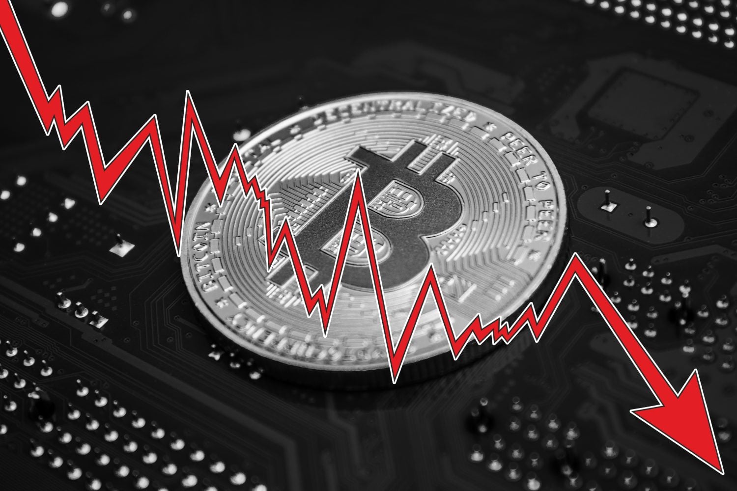 A silver Bitcoin coin is prominently displayed on a dark, out-of-focus circuit board. A vibrant red, jagged line graph with a large downward-pointing arrow is superimposed diagonally across the image, symbolizing a sharp decrease in value or a market crash.