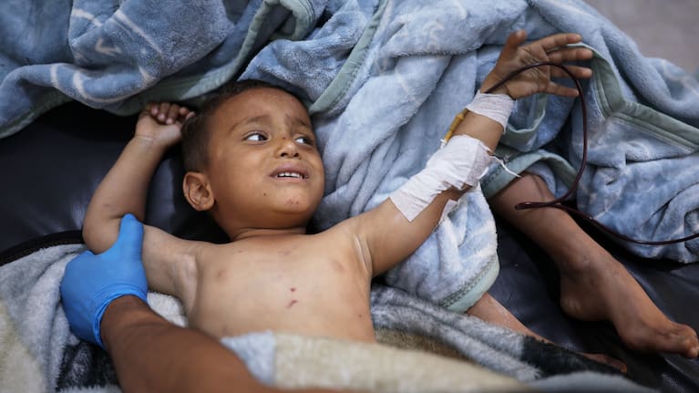 A child wounded in an explosion caused by war remnants while playing with other children in the village of Abu Habbah in eastern Idlib countryside