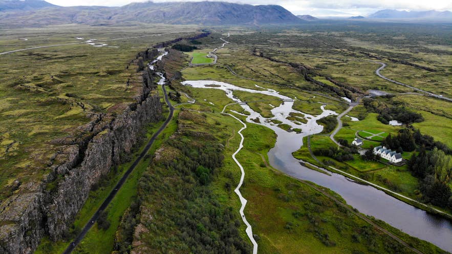 Forests in Iceland grow along the rift valley floor in Thingvellir National Park, surrounded by rivers and rugged cliffs.