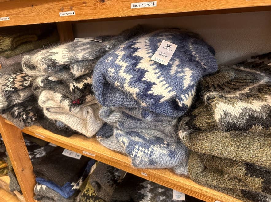 Stacked Icelandic lopapeysa wool sweaters on shelves in a Reykjavik shop Stacked Icelandic lopapeysa wool sweaters on shelves in a Reykjavik shop