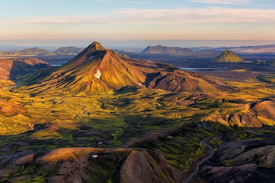 Thorsmork’s rugged landscape glows under soft light, showcasing Iceland in August’s vibrant nature. Thorsmork’s rugged landscape glows under soft light, showcasing Iceland in August’s vibrant nature.