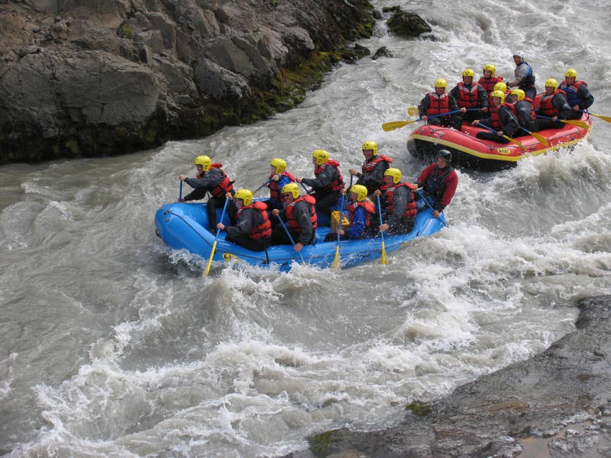Two groups rafting white water rapids in Hvita River, a thrilling experience in Iceland, especially in August. Two groups rafting white water rapids in Hvita River, a thrilling experience in Iceland, especially in August.