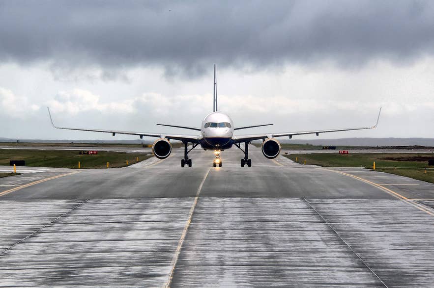 Plane on the runway at Keflavik Airport in Iceland.