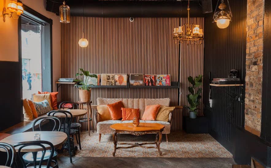 Stylish 22 Bar in Reykjavik with vintage decor, vinyl records, and cozy seating area.