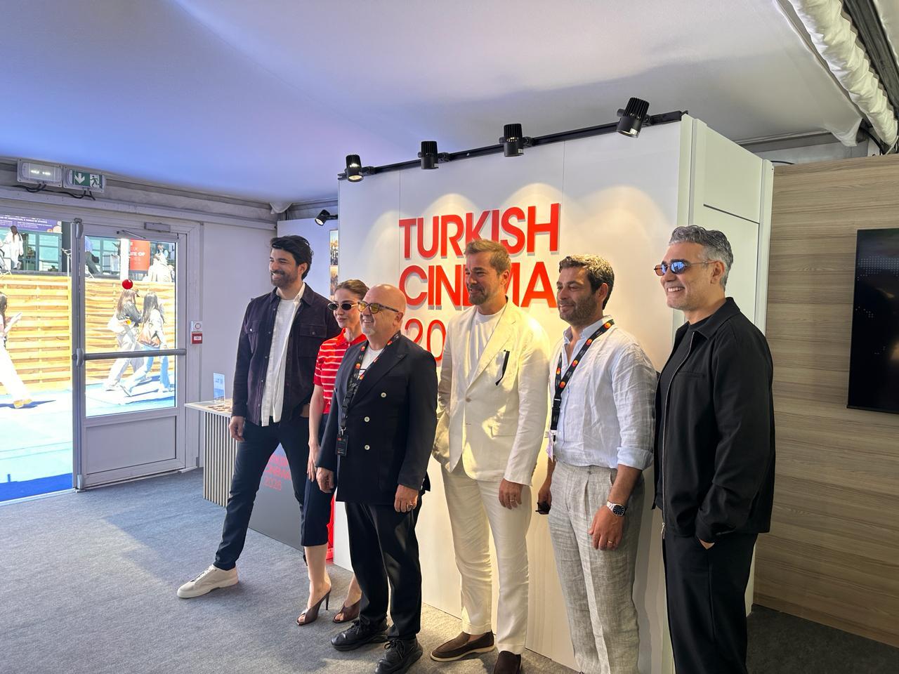 Cinema Directorate General head Birol Guven and Turkish actors pose at the Turkish Cinema 2026 stand during the Cannes Film Festival in Cannes, France. (Photo via Culture and Tourism Ministry)