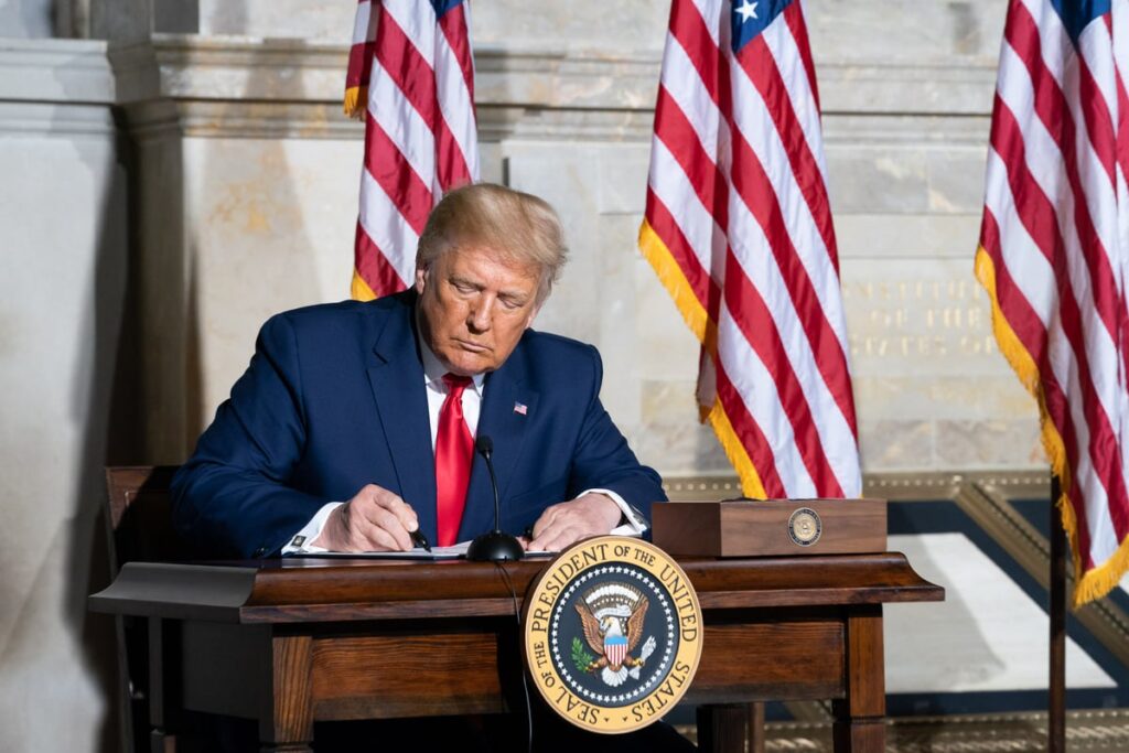 Stock Market Investors Just Got Bad News About President Trump’s Economy President Donald J. Trump signs a document.