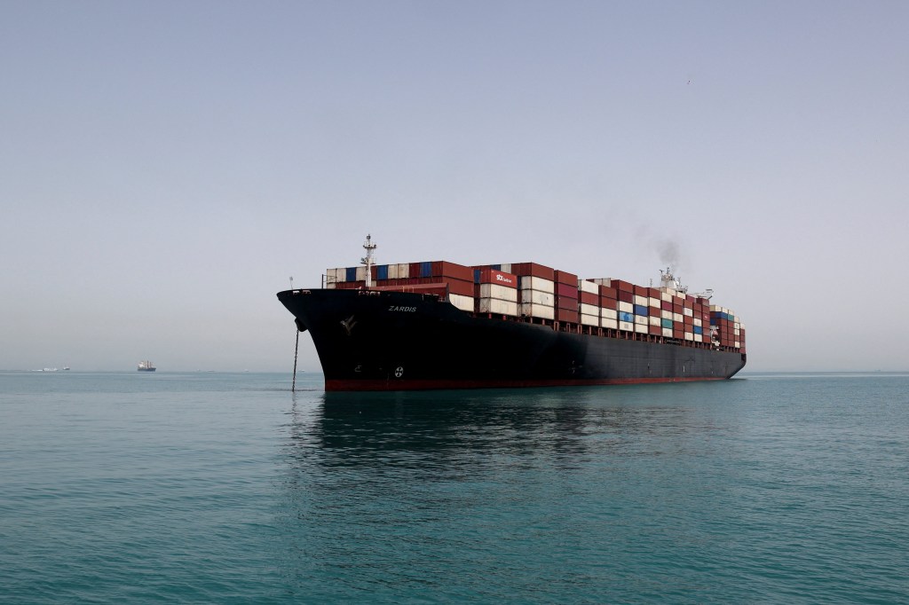 A large container ship, the ZARDIS, anchored in the Strait of Hormuz.