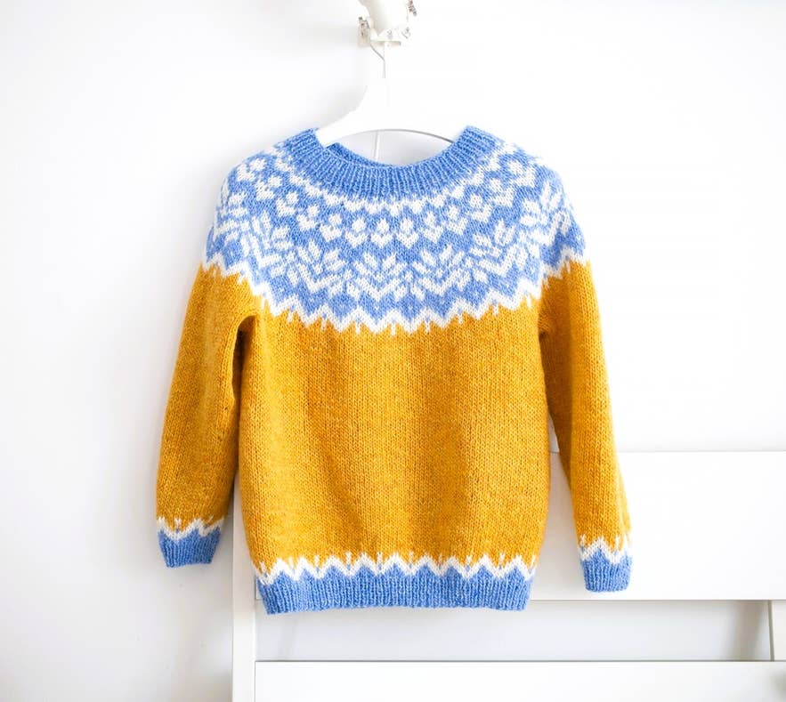 Traditional Icelandic lopapeysa sweater, a cozy essential for what to wear in Iceland during cold weather. Traditional Icelandic lopapeysa sweater, a cozy essential for what to wear in Iceland during cold weather.