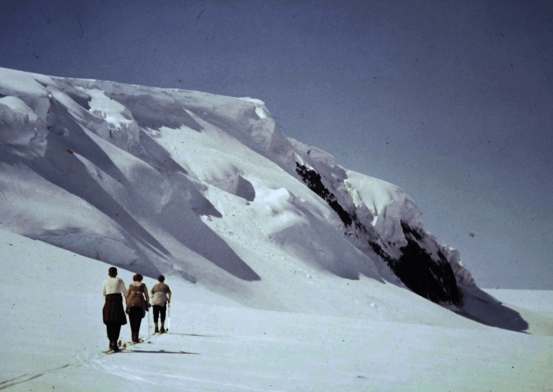 Women walk in skis on glacier. Image: Archival Materials Courtesy of Andri Snær Magnason.

