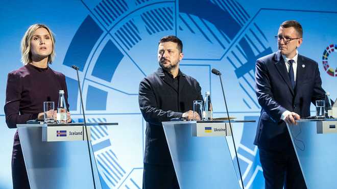 Ukrainian President Volodymyr Zelensky (C) and Estonia's Prime Minister Kristen Michal (R) listen as Iceland's Prime Minister Kristrun Frostadottir speaks during a joint press conference during the Nordic and Baltic Prime Ministers' (NB8) Summit 2026 at the Stenbock House (Statehood House) in Tallinn, Estonia on June 9, 2026. The Nordic-Baltic leaders declared support to Ukraine's "irreversible path" to NATO membership, after a summit on June 9 in Tallinn with President Zelensky. (Photo by RAIGO PAJULA / AFP via Getty Images)