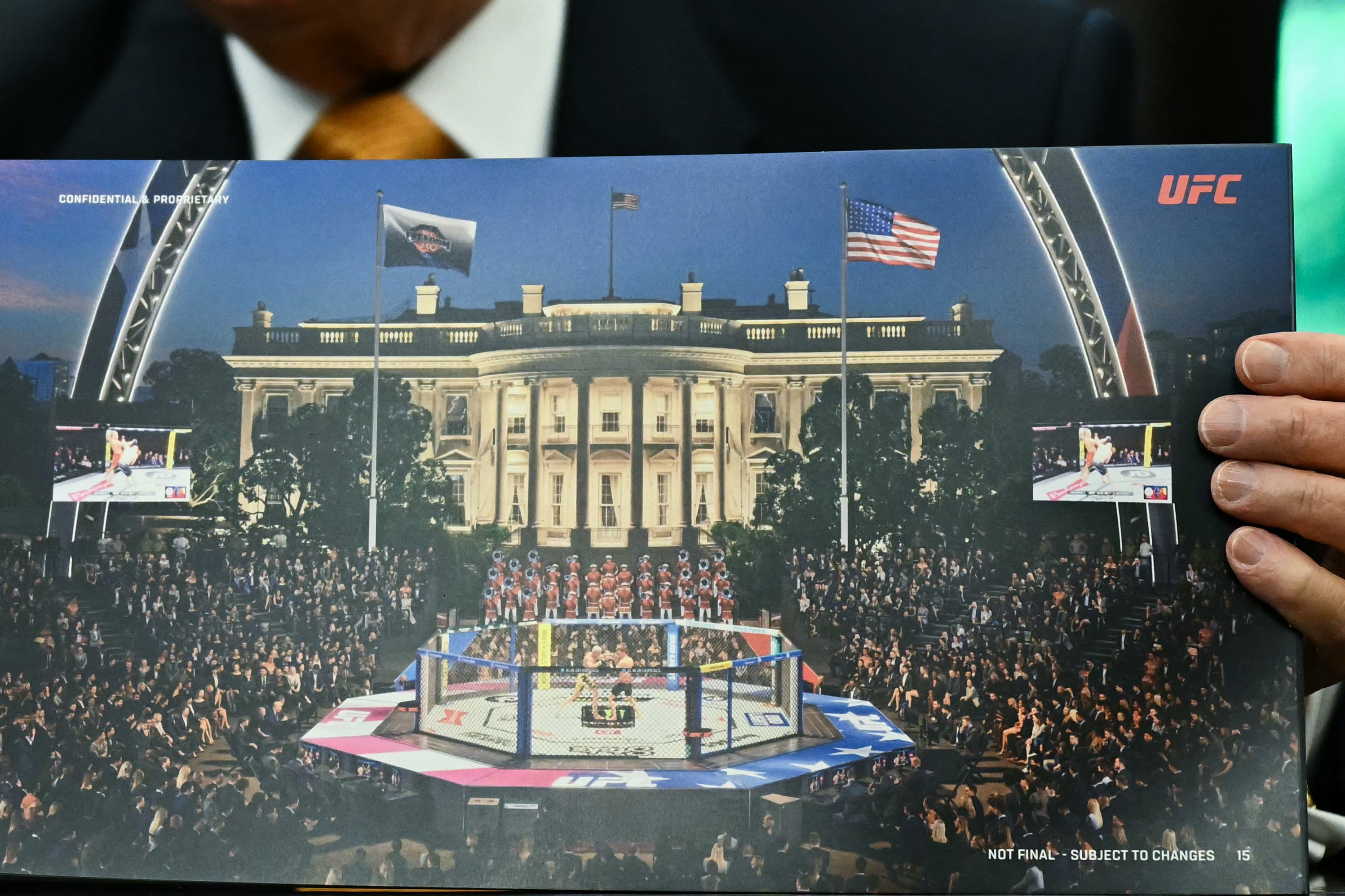 Trump holding a mock-up image of the UFC’s Octagon on the South Lawn