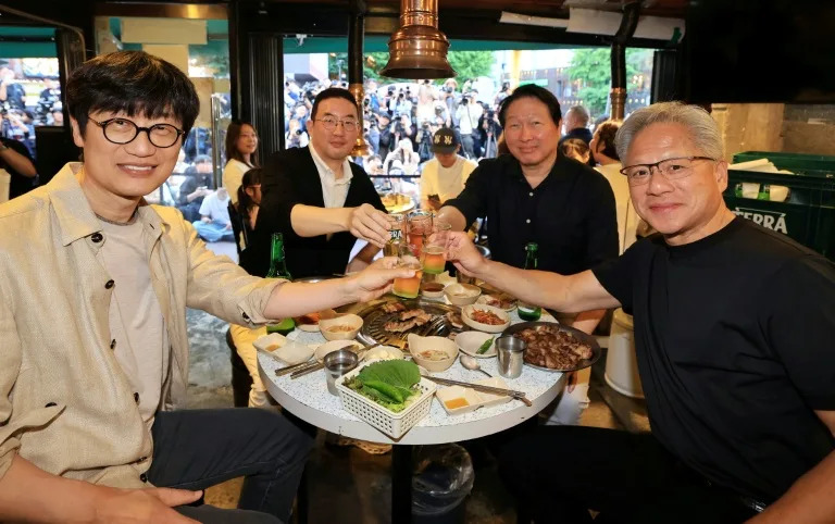 The deals were unveiled after Nvidia CEO Jensen Huang (R) spent the weekend in South Korea (-)