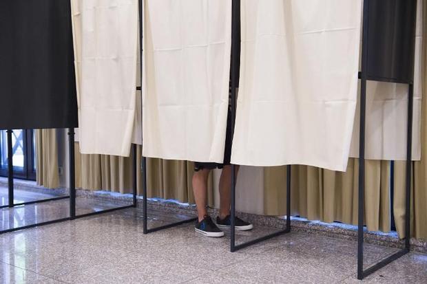 Luxembourg rules out full voting rights for foreigners A person votes in a booth on June 7 2015 in Mamer-Capellen Luxembourg in a referendum on whether ...