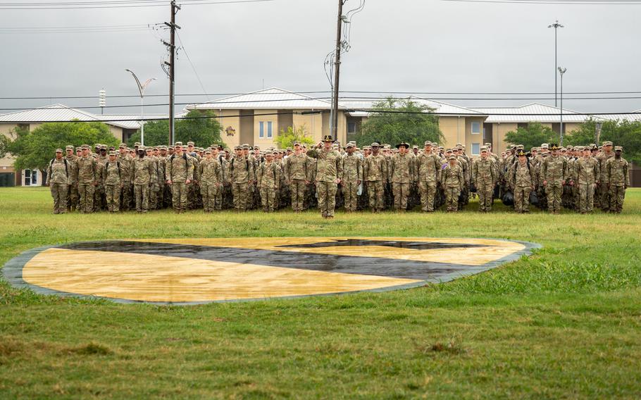 Soldiers standing on a field.