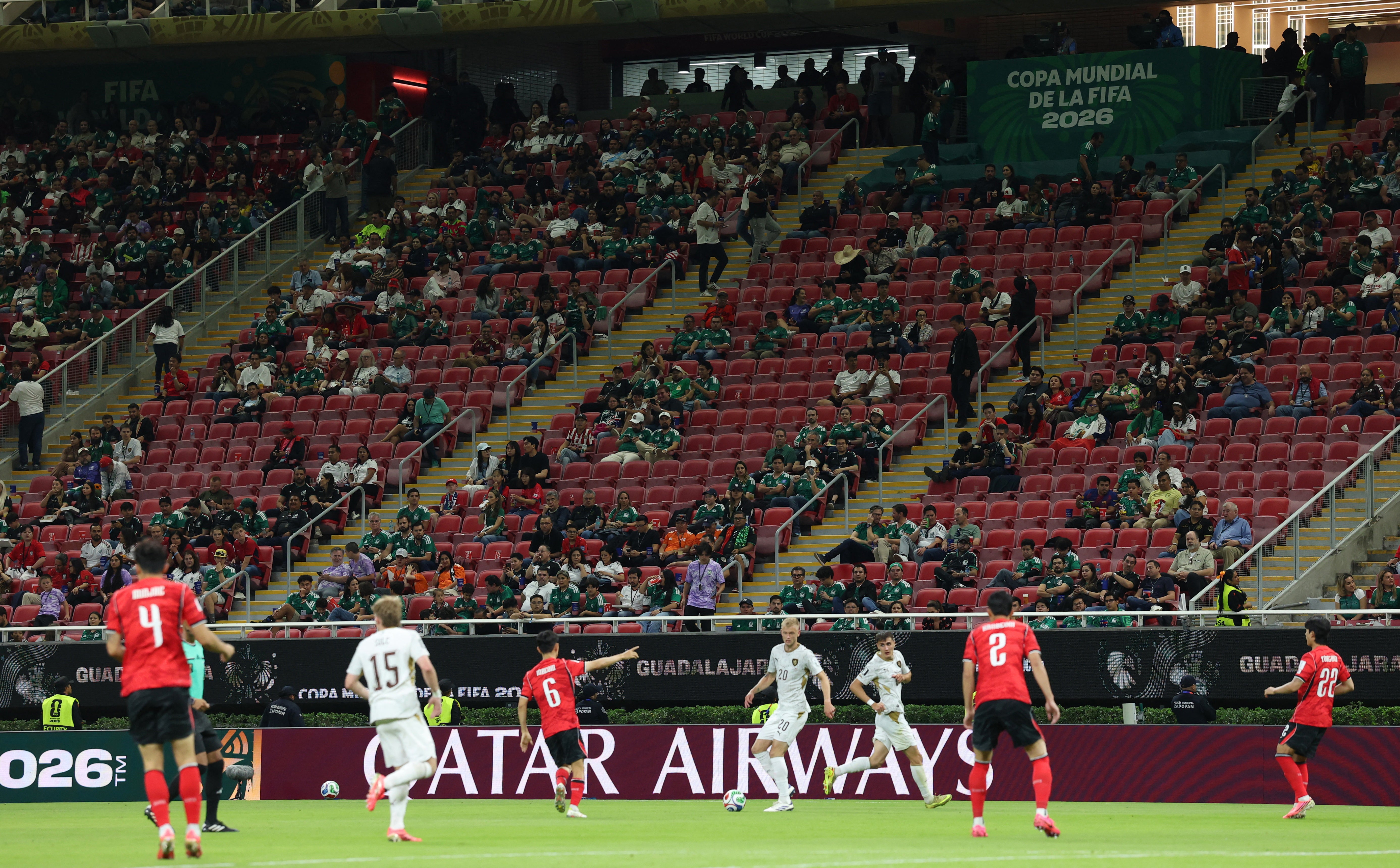 Empty seats are seen in the stands during the match
