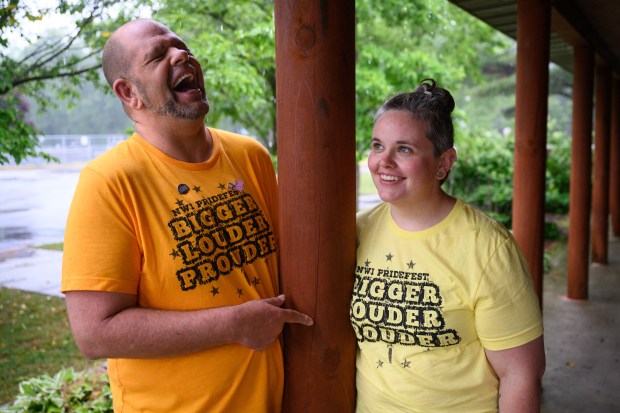Pridefest runners, on left, drag entertainer Jeremy Gregson, known on stage as Jessica DuPreé Chilton, and United Methodist Church Minister Leah Peksenak laugh with each other as they pose for a photo at Riverview Park in Lake Station on Wednesday, June 18, 2025. (Kyle Telechan/for the Post-Tribune)