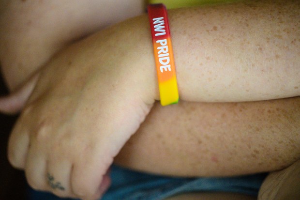 Pridefest runner, United Methodist Church minister, and LGBTQ+ rights advocate Leah Peksenak wears an "NWI Pride" bracelet as she speaks about the future of Pride Fest and LGBTQ+ rights in the region on Wednesday, June 18, 2025. (Kyle Telechan/for the Post-Tribune)