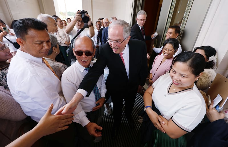 Elder Neil L. Andersen of the Quorum of the Twelve Apostles greets attendees before the Bacolod Philippines Temple dedication in Bacolod City, Philippines, on Sunday, May 31, 2026.