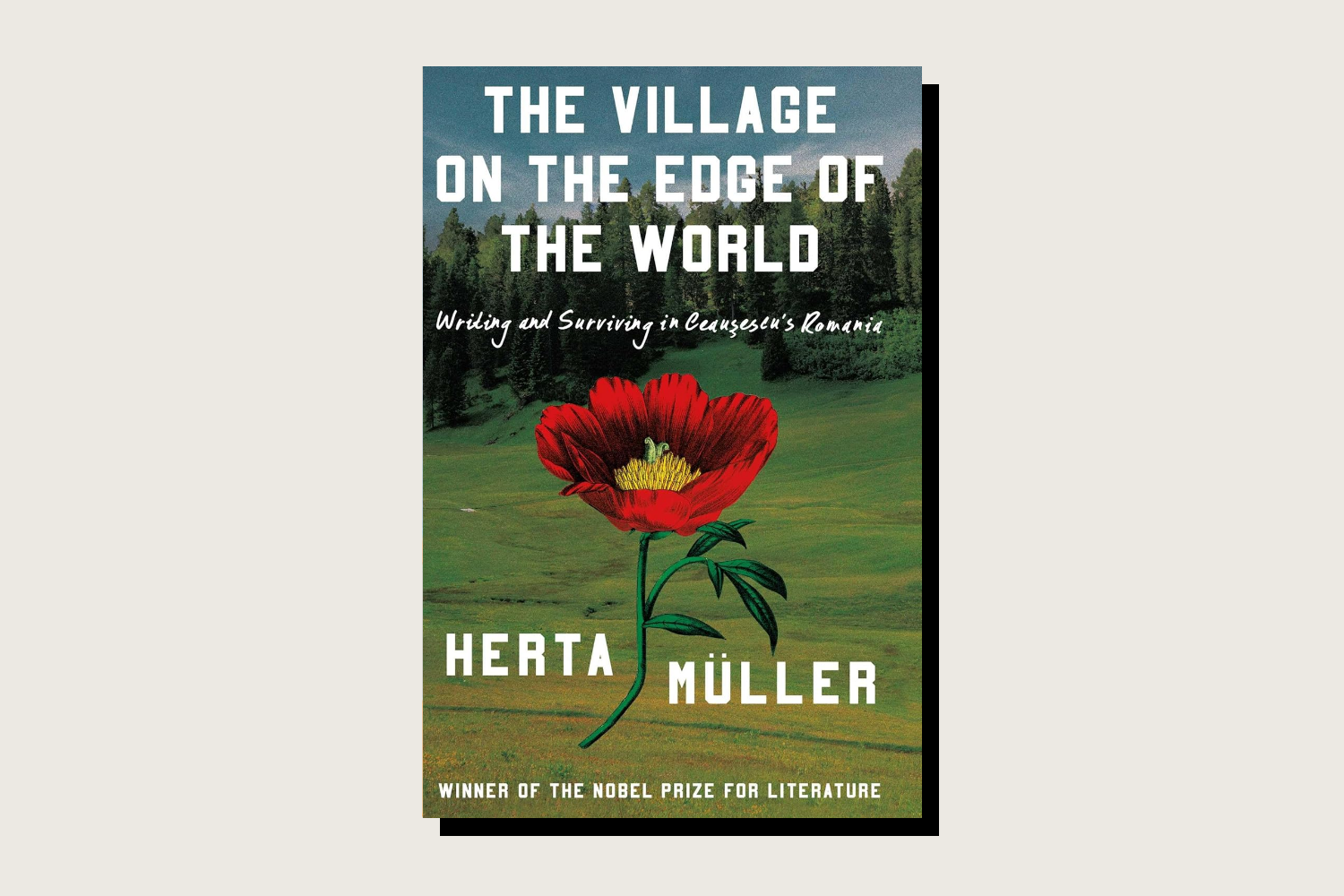Book cover featuring a background photo of a lush green rolling hillside under a cloudy sky, bordered by a dense pine forest at the top. A large, stylized red poppy flower is centered in the foreground. The title "THE VILLAGE ON THE EDGE OF THE WORLD" is printed in large, white, blocky capital letters across the top, with a subtitle in white cursive script below it. The author's name, "HERTA MÜLLER," is split on either side of the flower stem in large white text.