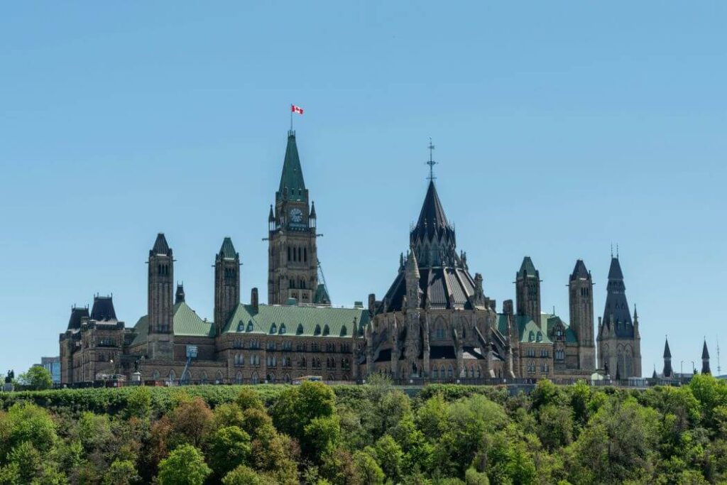 Canada bans “sophisticated deepfakes” of political figures A wide shot of the Canadian parliament