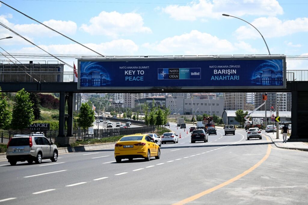 Billboards bearing the slogans “Key to Peace,” “Key to Security,” and “Shared Future in Peace” are seen at various points along the boulevard on the protocol route ahead of the NATO Summit as preparations continue in Ankara, Türkiye, on June 25, 2026. (AA Photo)