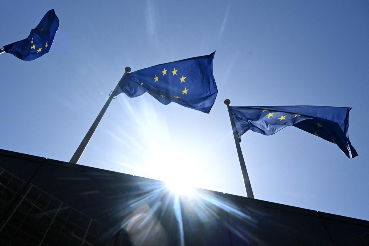 A photograph taken on May 28, 2026 shows the European flags flapping in the breeze in outside the EU headquarters in Brussels, Belgium. (AFP Photo)