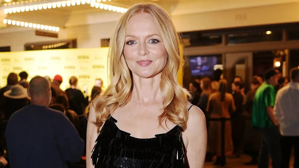 Heather Graham in a black dress