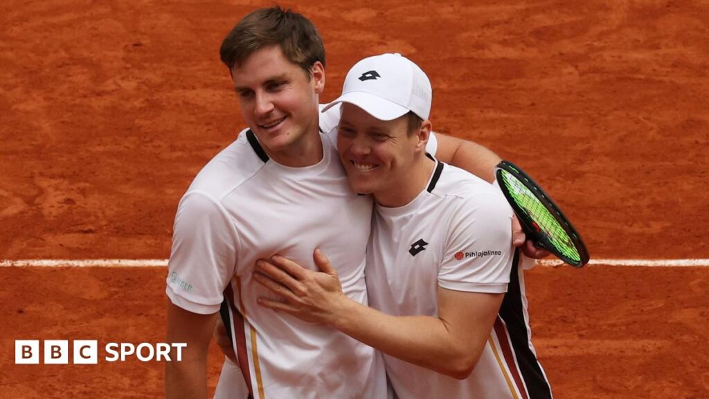 Harri Heliovaara of Finland and Henry Patten of Great Britain celebrate winning match point against Quentin Halys and Pierre-Hugues Herbert of France