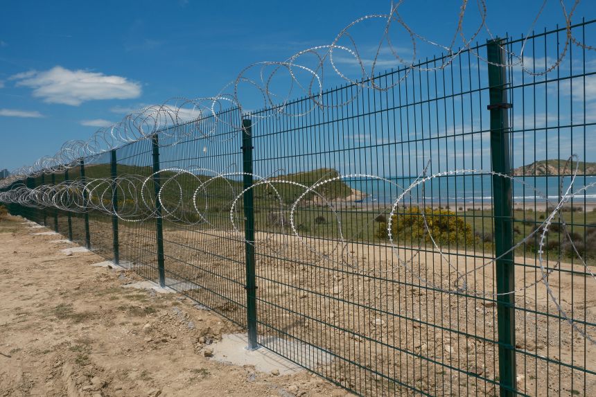 A photo provided by the conservation group PPNEA shows barbed wire fences erected at the site of the the Pishë Poro-Narta protected landscape.