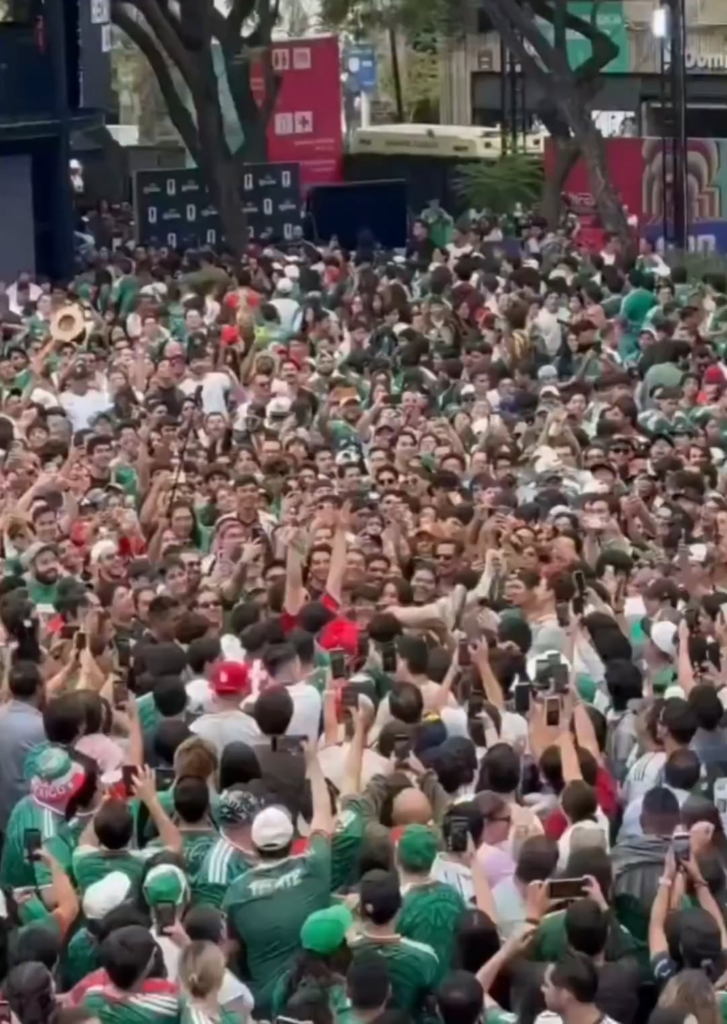 Mexican fans spot a South Korean fan and immediately adopt him