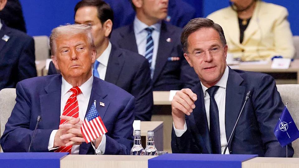 US President Donald Trump and NATO Secretary General Mark Rutte standing together at a summit.