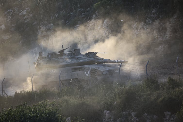 A tank operates in a hilly environment.
