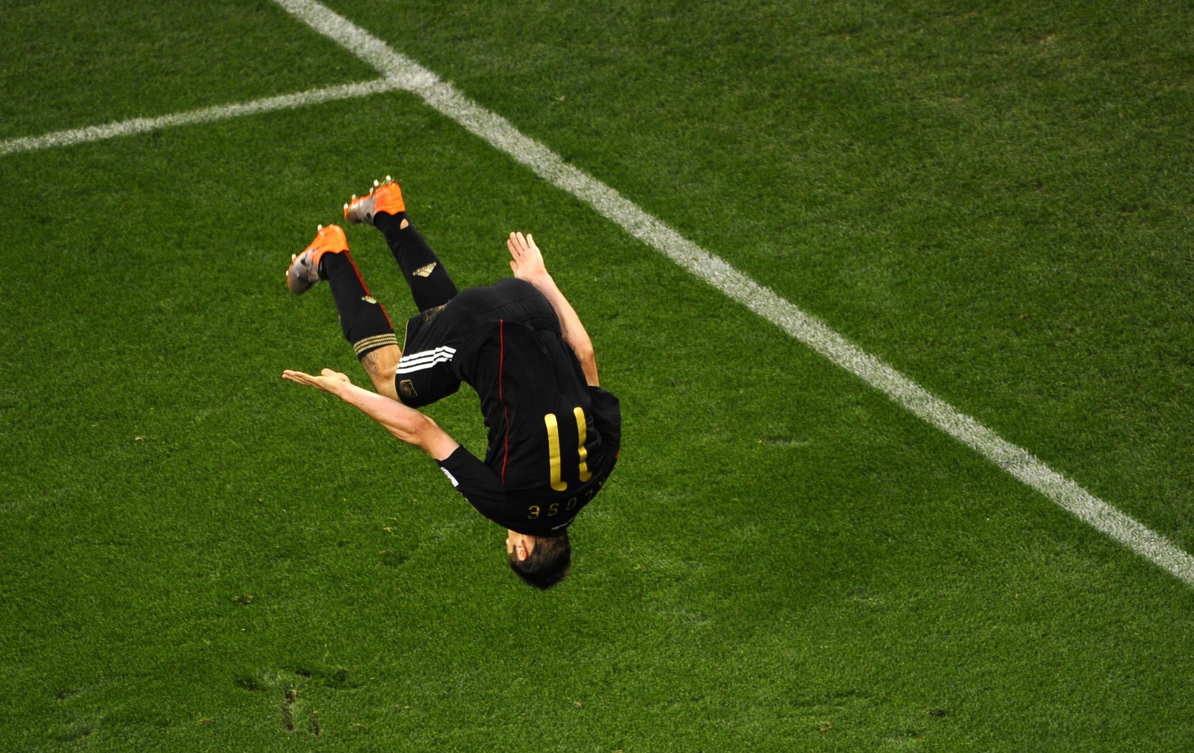 TOPSHOT - Germany’s striker Miroslav Klose does a flip as he celebrates scoring his team’s fourth goal during the 2010 World Cup quarter-final football match Argentina vs. Germany on July 3, 2010 at Green Point stadium in Cape Town. NO PUSH TO MOBILE / MOBILE USE SOLELY WITHIN EDITORIAL ARTICLE - AFP PHOTO / PIERRE-PHILIPPE MARCOU (Photo by PIERRE-PHILIPPE MARCOU / AFP via Getty Images)