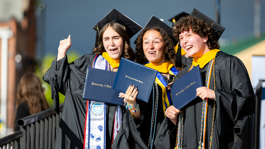 Giavanna A. Cucarese ’25, ’26 M.S. with students at graduation