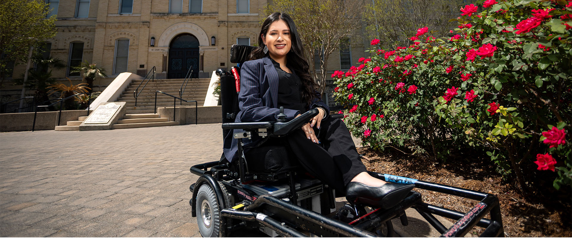 Political Science major Jado Cano outside St. Louis Hall on the St. Mary's University campus.