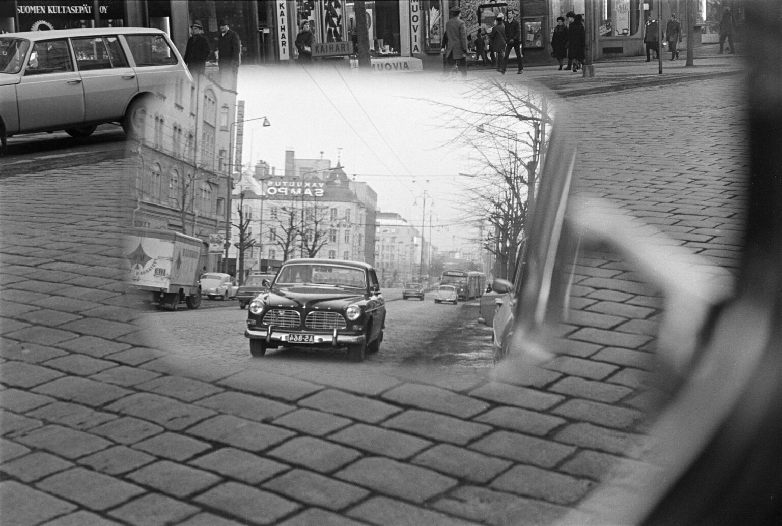 A street scene in Tampere, Finland reflected in a car's wing mirror. (1968)