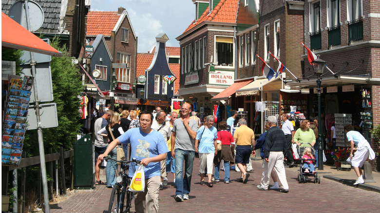 Tourists crowded along the dike promenade of Volendam