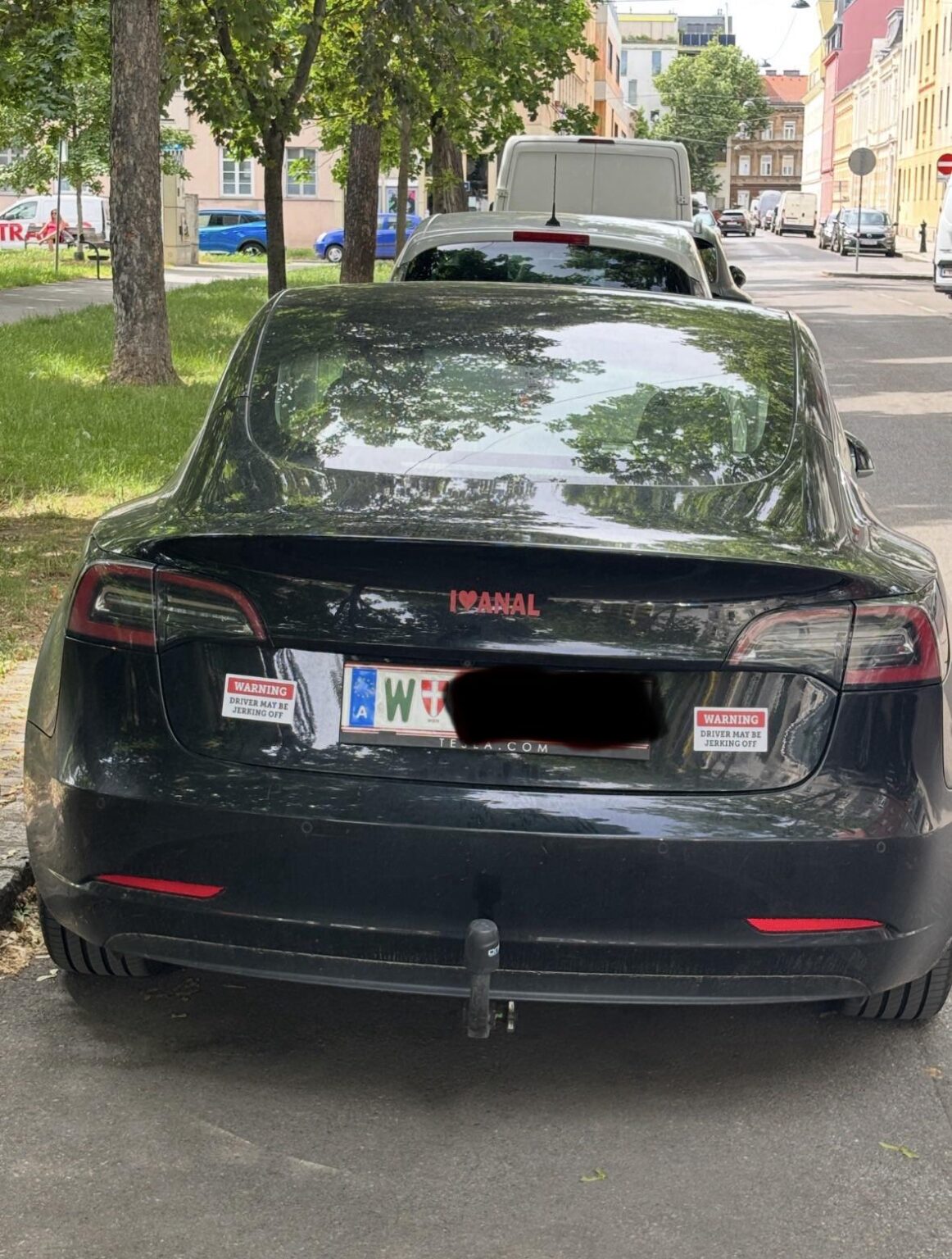 What some people stick on their Tesla...