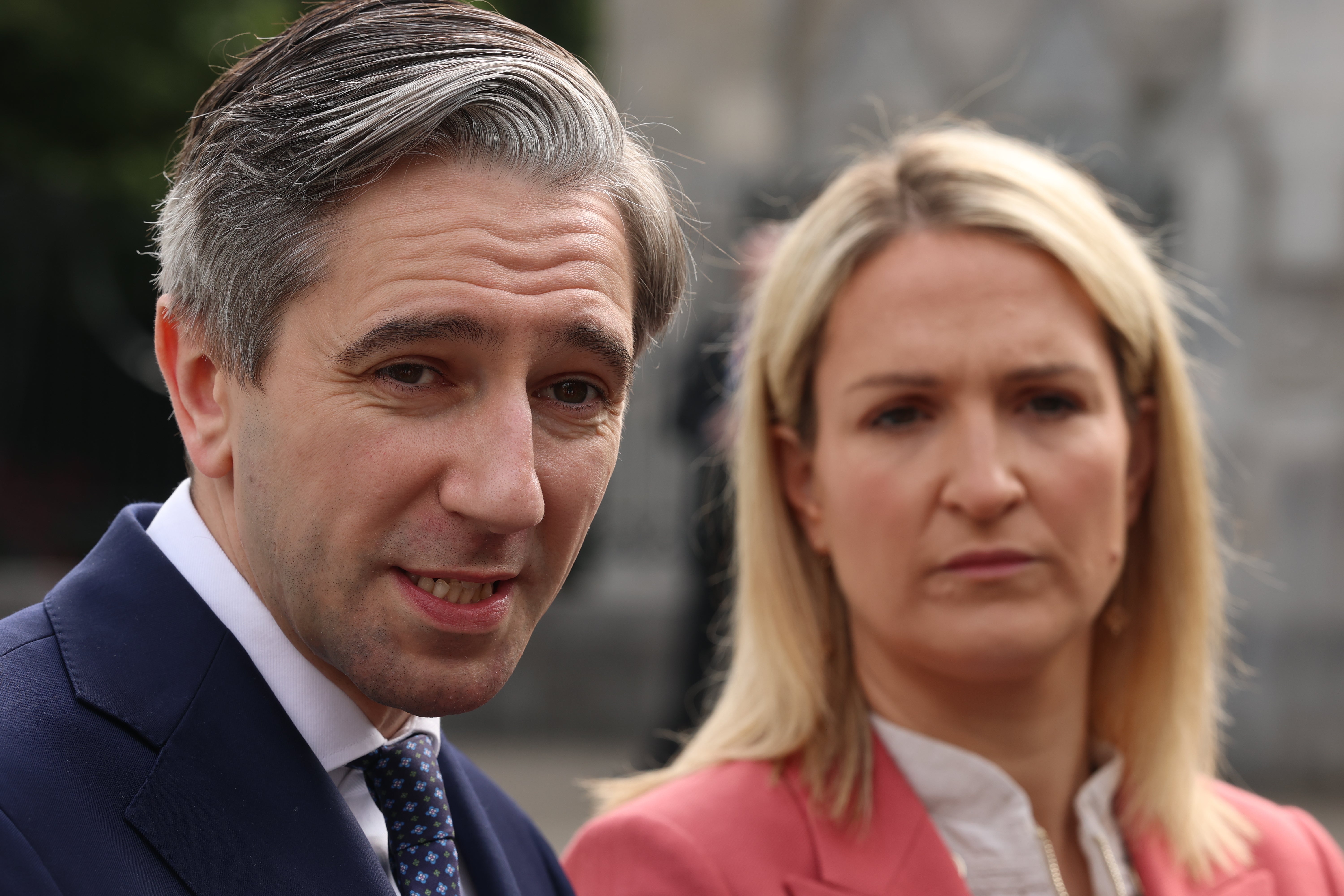 Tanaiste Simon Harris (left) and Irish Minister for Foreign Affairs Helen McEntee speaking to members of the media at University College Cork (Liam McBurney/PA)