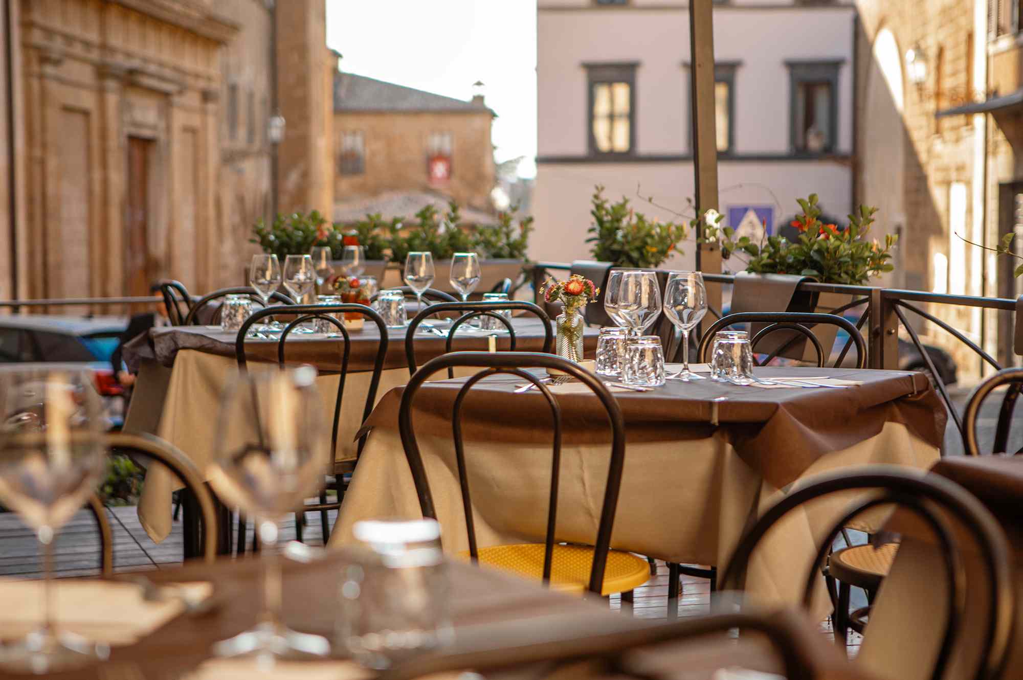 Set tables at a restaurant in Italy.Credit: Lorado/Getty Images
